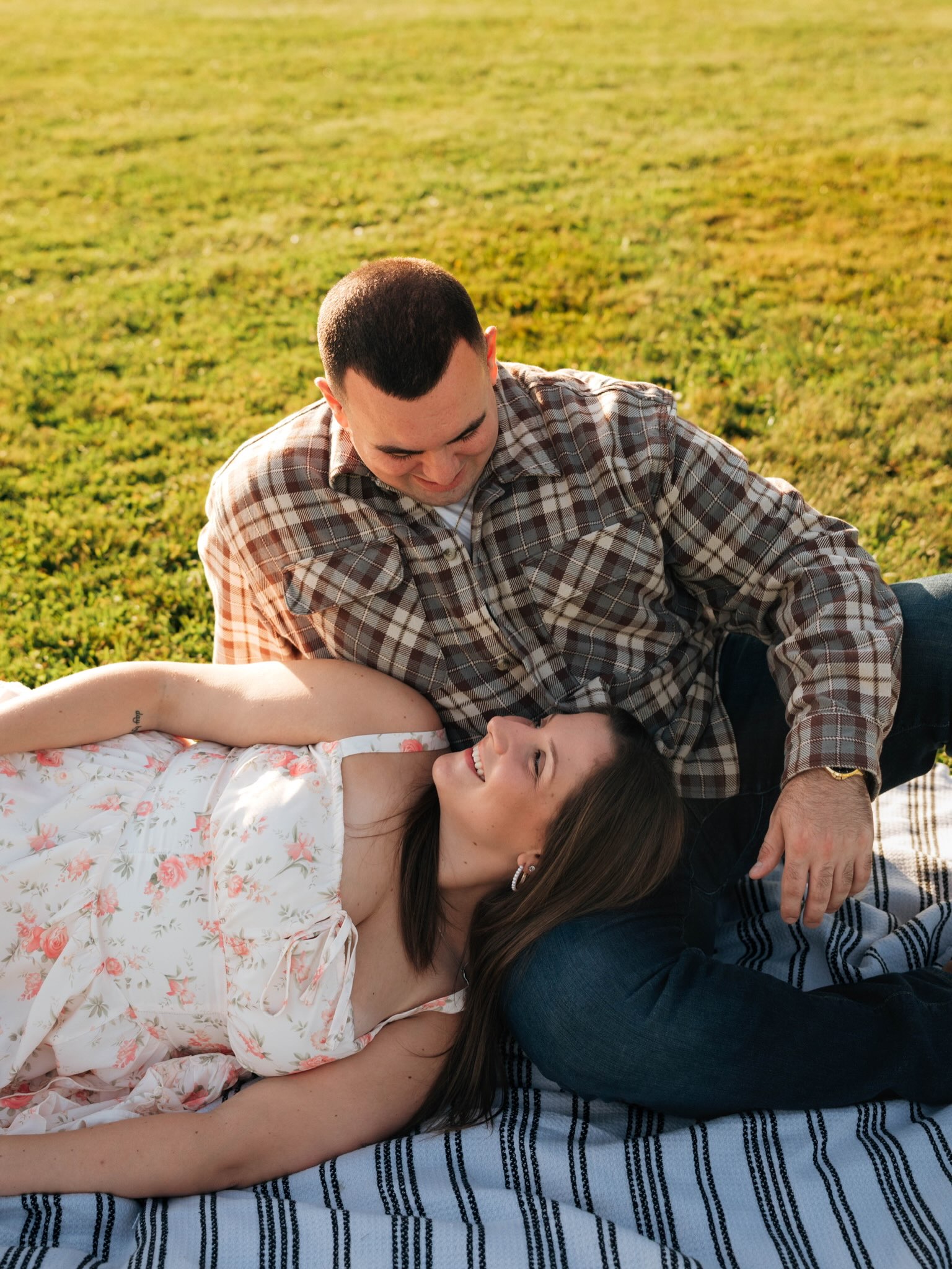 John and Erica sharing a quiet moment on their picnic blanket